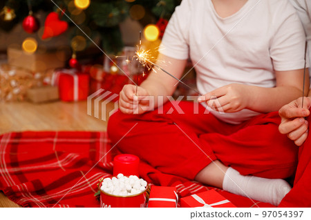Merry Christmas. Happy family celebrating winter holiday at home. 97054397