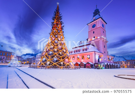 Brasov, Romania - Snowy Christmas Tree in downtown, touristic Transylvania. 97055575