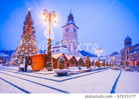 Brasov, Romania - Snowy Christmas Tree in downtown, touristic Transylvania. 97055577