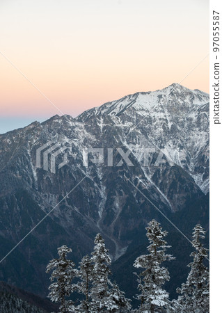Early winter Northern Alps seen from the ridgeline of the Japanese Alps Snow piles up on top of the mountains Mountains of the Northern Alps covered in snow 97055587
