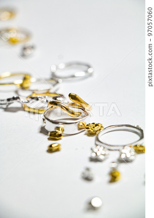 An image of a ring with a stylish atmosphere with multiple accessories scattered 97057060