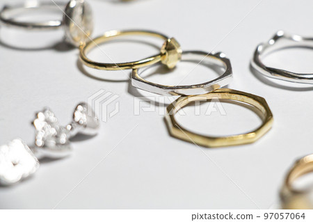 An image of a ring with a stylish atmosphere with multiple accessories scattered An image of a ring with a stylish atmosphere with multiple accessories scattered 97057064