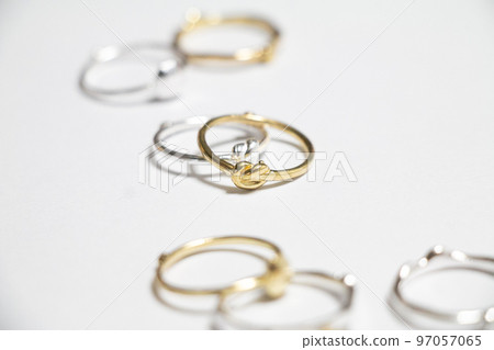 An image of a ring with a stylish atmosphere with multiple accessories scattered 97057065