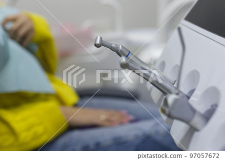 Different dental instruments and tools in a dentists office Different dental instruments and tools in a dentists office 97057672