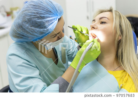 Dental health concept. female mouth on treatment in a dental clinic, Dental health concept. female mouth on treatment in a dental clinic, 97057683