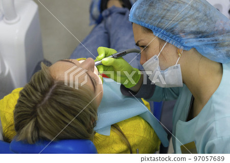Dental health concept. female mouth on treatment in a dental clinic, Dental health concept. female mouth on treatment in a dental clinic, 97057689