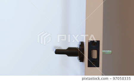 Hand open wooden door. Close up Hand open wooden door. Close up 97058335