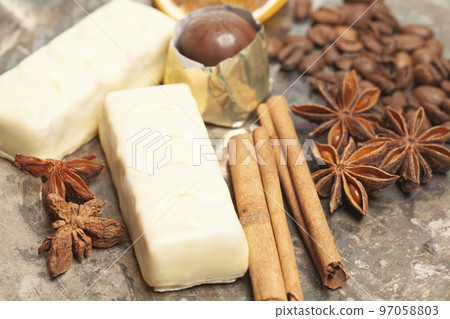 White chocolate candies with anise,cinnamon sticks,coffee beans. White chocolate candies with anise,cinnamon sticks,coffee beans. 97058803