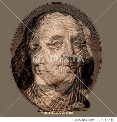 Double exposure of portrait of U.S. presidents Benjamin Franklin and Alexander Hamilton. 97058810