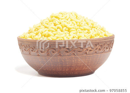 Italian pasta in brown clay bowl isolated on white background 97058855