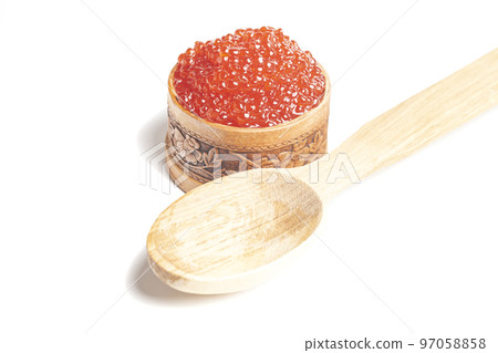 delicious red caviar in wooden bowl isolated on white background. 97058858