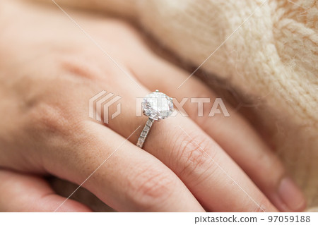 Female hand with beautiful jewelry diamond ring Female hand with beautiful jewelry diamond ring 97059188