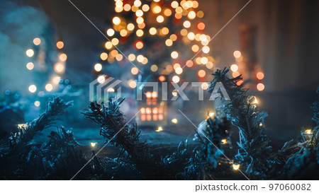 The little house with candle and tree as background The little house with candle and tree as background 97060082