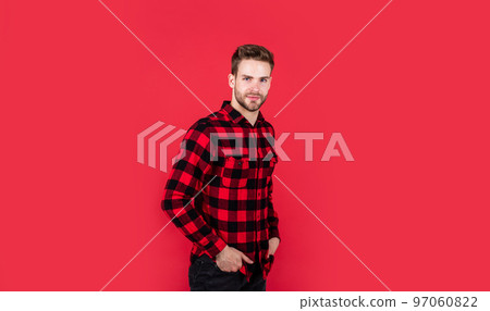 young handsome man in checkered shirt has bristle on face, style young handsome man in checkered shirt has bristle on face, style 97060822