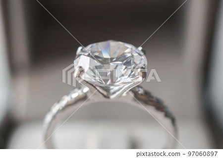 Diamond ring in jewelry gift box close up background Diamond ring in jewelry gift box close up background 97060897