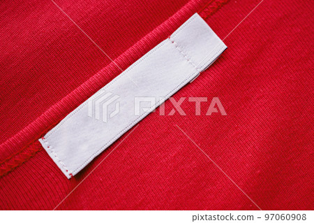 Blank white clothes tag label on new red shirt 97060908