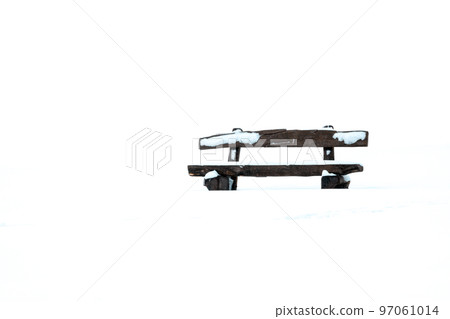 Simple image of a park bench in the snow Simple image of a park bench in the snow 97061014