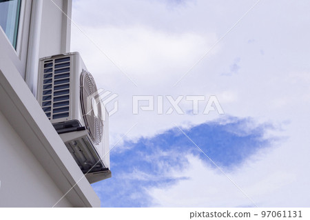 Air condition outdoor unit compressor install outside the house with blue sky 97061131
