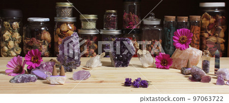 Amethyst Crystals and Flowers On Meditation Table 97063722