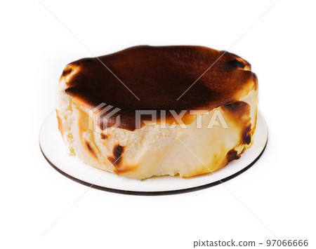 San sebastian cheesecake on plate isolated San sebastian cheesecake on plate isolated 97066666