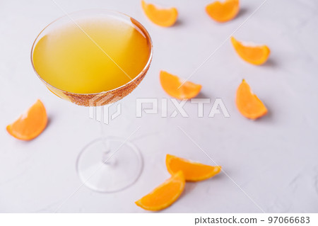 Glass of sidecar orange cocktail top view 97066683