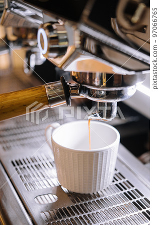 Macro shot of preparing espresso on professional coffee machine 97066765