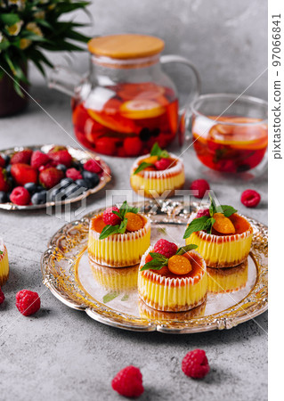 Mini cheesecake with apricot in muffin forms 97066841