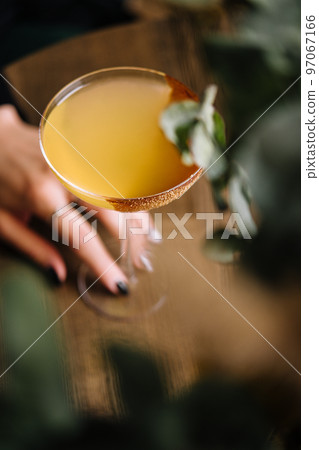 Glass of sidecar orange cocktail top view Glass of sidecar orange cocktail top view 97067166