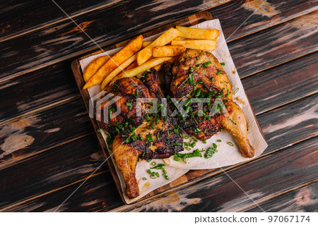 roasted chicken Piri Piri with french fries roasted chicken Piri Piri with french fries 97067174
