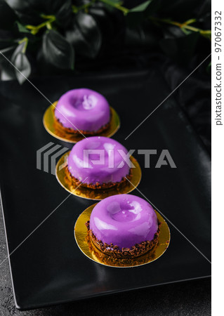 Mousse cakes from wild berries on plate Mousse cakes from wild berries on plate 97067332