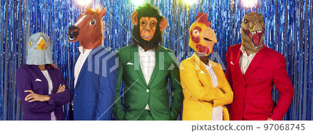 Group of funny people in different suits and carnival animal masks at costume party 97068745