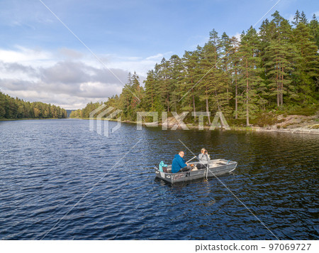 aerial footage couple Kayaking Boat tour on lake Ragnerudssjoen in Dalsland Sweden beautiful nature forest pinetree aerial footage couple Kayaking Boat tour on lake Ragnerudssjoen in Dalsland Sweden beautiful nature forest pinetree 97069727