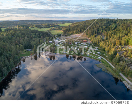aerial footage campsite camping caravan by lake Ragnerudssjoen in Dalsland Sweden beautiful nature forest pinetree aerial footage campsite camping caravan by lake Ragnerudssjoen in Dalsland Sweden beautiful nature forest pinetree 97069738