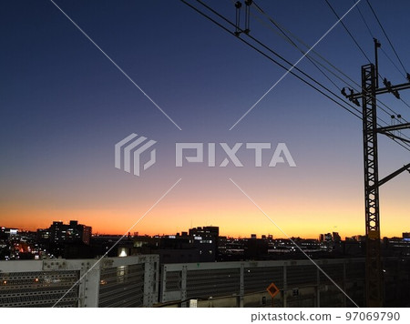 Dusk sky seen from JR Nishi-Funabashi station platform Dusk sky seen from JR Nishi-Funabashi station platform 97069790