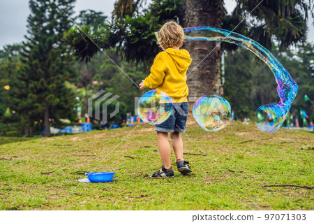 Young woman feeding an African Sacred ibis 97071303