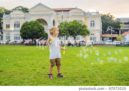 Young woman feeding an African Sacred ibis 97072020