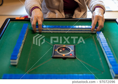 Senior female playing mahjong 97072096