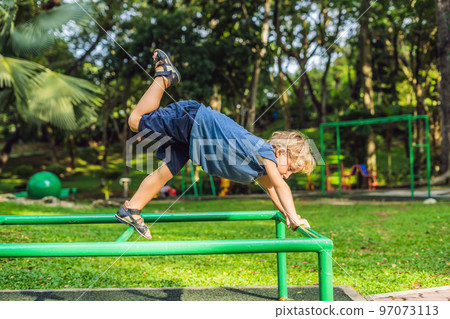 Portrait of child doing yoga in the park Portrait of child doing yoga in the park 97073113
