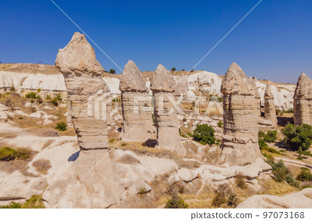 Unique geological formations in Love Valley in Cappadocia, popular travel destination in Turkey Unique geological formations in Love Valley in Cappadocia, popular travel destination in Turkey 97073168