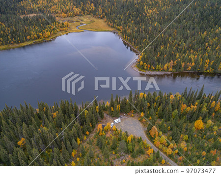 aerial view camping caravan near river autumn fall landscape along Ammarnas National Park in Lapland Sweden aerial view camping caravan near river autumn fall landscape along Ammarnas National Park in Lapland Sweden 97073477