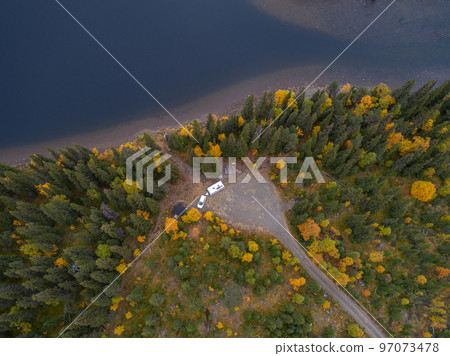 aerial view camping caravan near river autumn fall landscape along Ammarnas National Park in Lapland Sweden 97073478