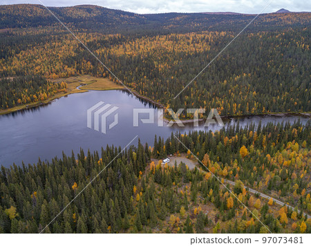 aerial view camping caravan near river autumn fall landscape along Ammarnas National Park in Lapland Sweden 97073481