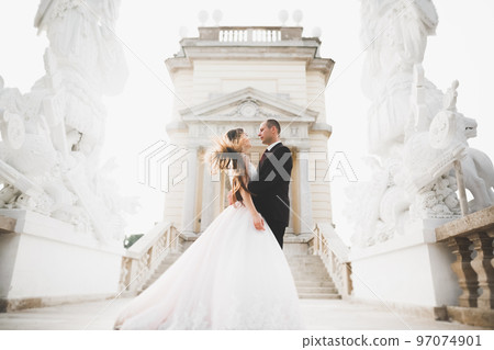 Luxury married wedding couple, bride and groom posing in old city 97074901