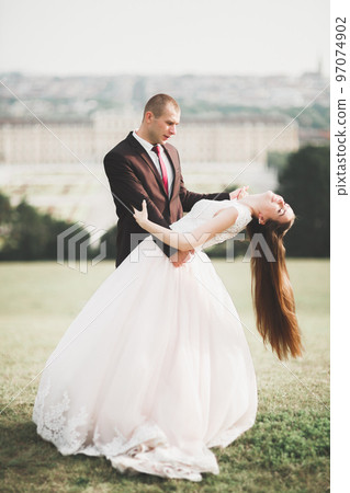 Caucasian happy romantic young couple celebrating their marriage. Outdoor 97074902