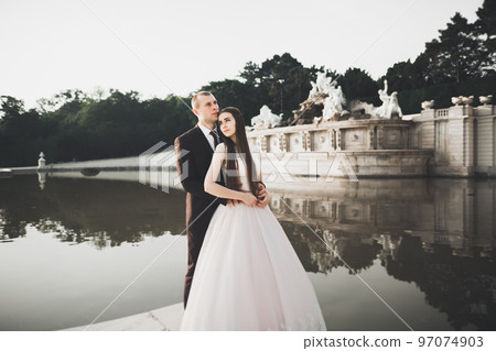Luxury married wedding couple, bride and groom posing in luxury city 97074903