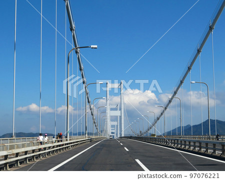 A family cycling the Shimanami Kaido A family cycling the Shimanami Kaido 97076221