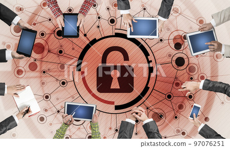 Top view of businesspeople sitting at table and using gadgets Top view of businesspeople sitting at table and using gadgets 97076251