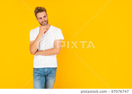 man with bristle in white shirt. positive young man with beard on yellow background. man with bristle in white shirt. positive young man with beard on yellow background. 97076747