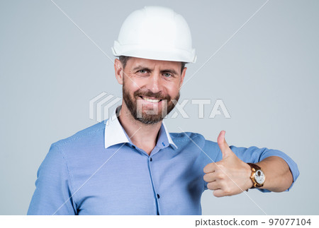 confident businessman in hard hat show thumb up. safety business. confident businessman in hard hat show thumb up. safety business. 97077104