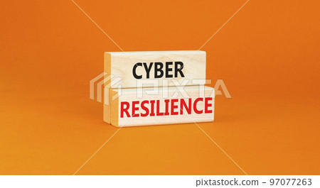 Cyber resilience symbol. Concept word Cyber resilience typed on wooden blocks. Beautiful orange table orange background. Business and cyber resilience concept. Copy space. 97077263